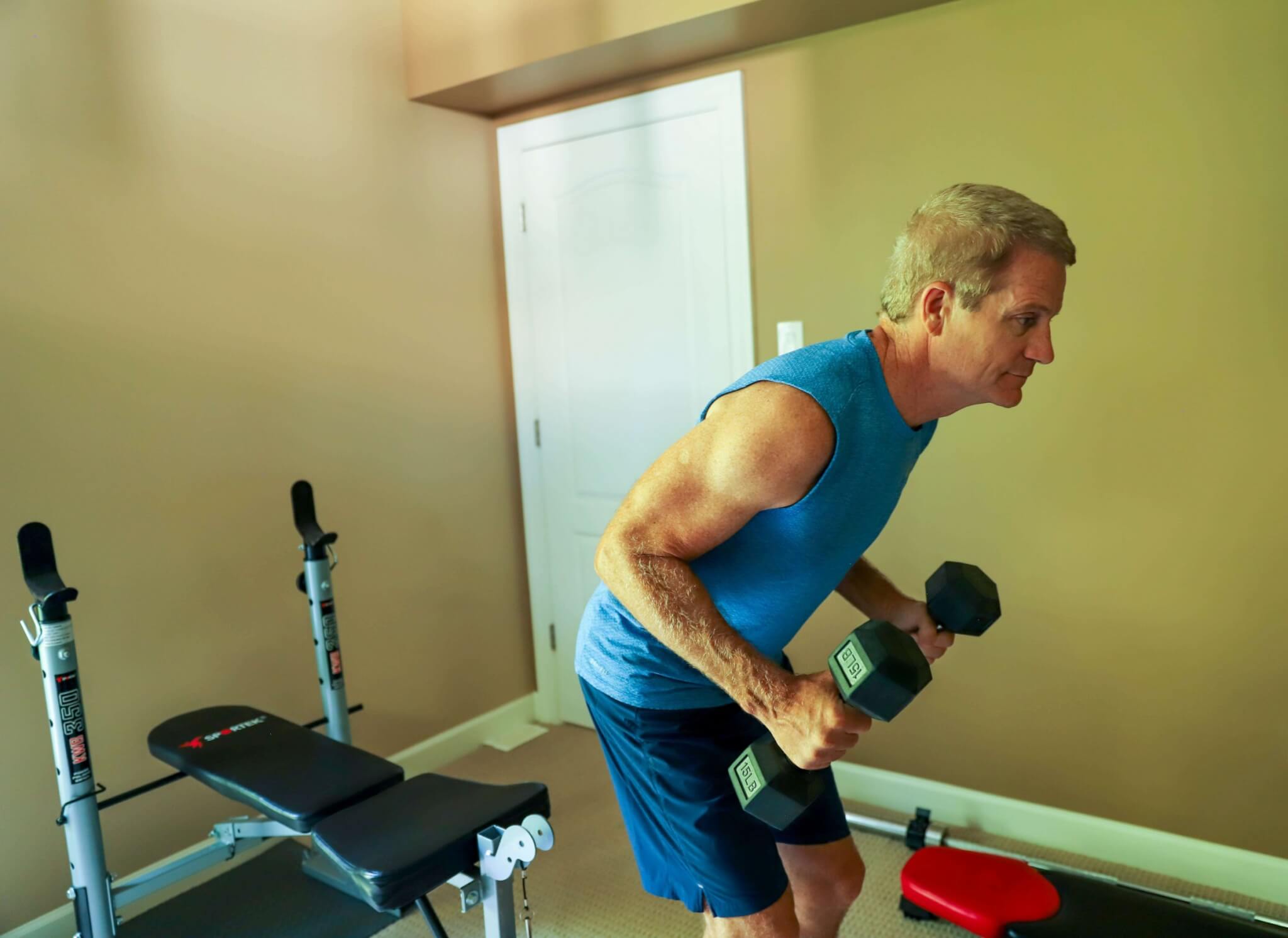 man using dumbbells, sam's club men's grooming products