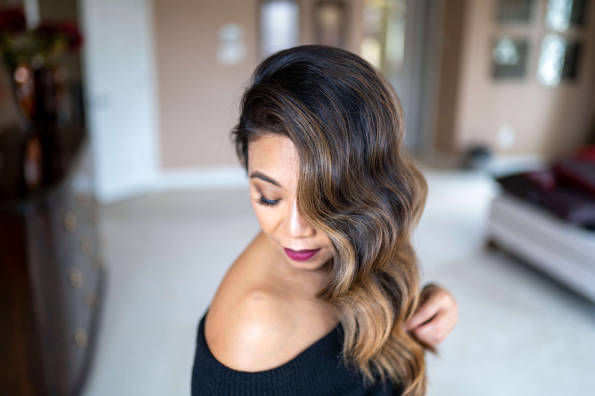 woman facing down, showing her Hollywood Waves hairstyle